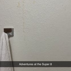 Super 8 by Wyndham Princeton - Towel that is NOT ours and something yellow dripping on walls in bathroom.