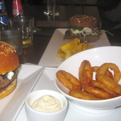 Burgerz - Lamb burger on left, onions rings with tzatziki sauce, and portebello mushroom burger with mozzarella and pesto sauce.