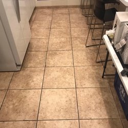 Midland Floor Care - Soiled tile and grout in breakroom area of retail space before cleaning