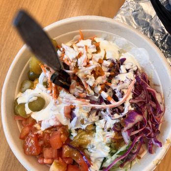 Roti - a bowl of food with a fork in it - Mediterranean Near Me - Northbrook, Illinois