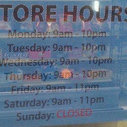 Sams Wine & Spirit - Store Hours sign
