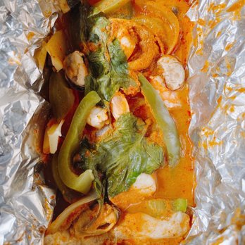 Jasmine Thai Cuisine - Pohtaak - Seafood dish (shrimp, scallop, mussel, fish) cooked in this foil packet - Thai Near Me - Chesapeake, Virginia Jasmine Thai Cuisine - Pohtaak - Seafood dish (shrimp, scallop, mussel, fish) cooked in this foil packet - Thai Near Me - Chesapeake, Virginia