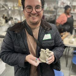 Crystal Shade Pottery - Student with his pottery