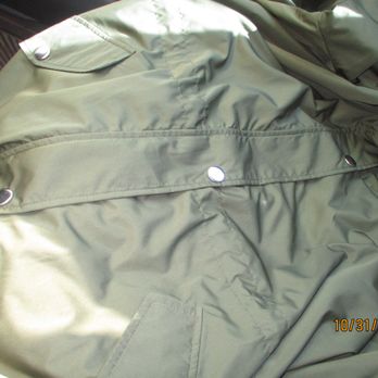 Angelica's Custom Tailors - Snap repaired on my raincoat -in the middle of photo - perfect match with photo flashlight illuminating it in the middle of the picture - Sewing & Alterations Near Me - Campbell, California