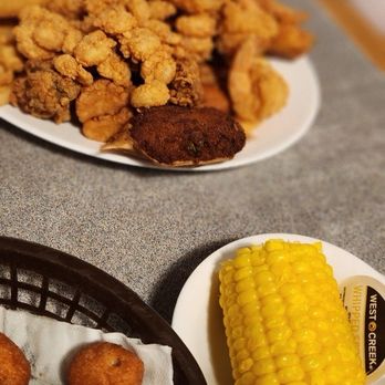 Captain Steve's - Sweet corn on a cob Hush puppies  Captains sampler - Seafood Near Me - Fort Mill, South Carolina