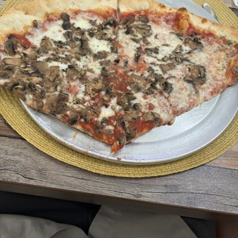 Sans Pizzeria - Two slices of mushroom pizza - Italian Near Me - Ocala, Florida Sans Pizzeria - Two slices of mushroom pizza - Italian Near Me - Ocala, Florida