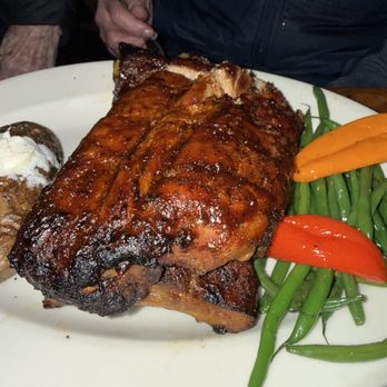 Buckhorn Steakhouse - Rack of pork ribs with baked potato and green beans - Steakhouses Near Me - Winters, California Buckhorn Steakhouse - Rack of pork ribs with baked potato and green beans - Steakhouses Near Me - Winters, California