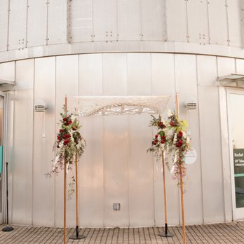 Afikomen Judaica - Beautiful chuppah rented from Afikomen decorated with flowers by our florist - Bookstores Near Me - Berkeley, California