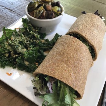 Good Life Cafe - The eggplant bacon wrap with a side of Brussels and kale salad - Vegan Near Me - Columbia, South Carolina Good Life Cafe - The eggplant bacon wrap with a side of Brussels and kale salad - Vegan Near Me - Columbia, South Carolina
