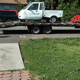 Ron's small truck getting towed away by Pacfic Golf & Turf