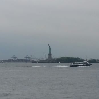 The Battery - Lady Liberty stands tall in the distance (looking south from Battery Park) - Parks Near Me - New York, New York The Battery - Lady Liberty stands tall in the distance (looking south from Battery Park) - Parks Near Me - New York, New York