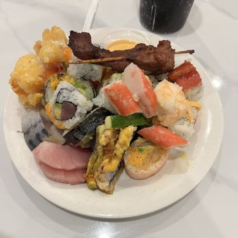 Kingdom Buffet - An assortment of items such as sushi rolls, sashimi, coconut shrimp, chicken teriyaki. - Buffets Near Me - Newington, Connecticut