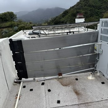 Environmental Solar Design - blown off solar panel that crashed into our HVAC system - Solar Installation Near Me
