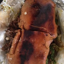 Caruthers Food & Liquors - Barbacoa Torta piled high with goodies. Half is a good lunch.
