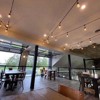 Fenelon Falls Brewing - Upstairs seating overlooking the waterway - Breweries Near Me - Kawartha Lakes, Ontario Fenelon Falls Brewing - Upstairs seating overlooking the waterway - Breweries Near Me - Kawartha Lakes, Ontario