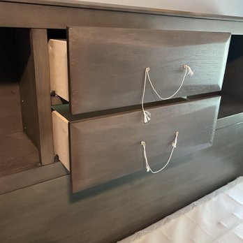 Ashley Store - They screwed the handles to the inside of the drawer and instead of fixing it they tied a string!!!! Ghettoooo ! - Furniture Stores Near Me - Springfield, Oregon