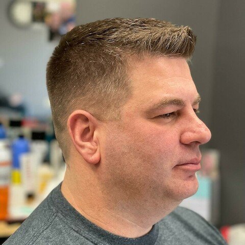 Muscle Cuts Barbershop Logo