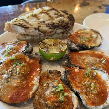 Shore Raw Bar & Grill - Grilled Oysters - chorizo-lime butter, cilantro, ciabatta - Seafood Near Me - Austin, Texas Shore Raw Bar & Grill - Grilled Oysters - chorizo-lime butter, cilantro, ciabatta - Seafood Near Me - Austin, Texas