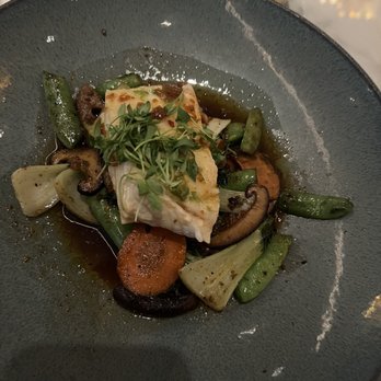 Spago - Halibut with veggies are delish. The sauce makes the dish. Without the sauce, the halibut would be plain. - New American Near Me - Las Vegas, Nevada