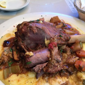 Della Santina's - Small Lamb shank on creamy polenta with root vegetables - Italian Near Me - Sonoma, California Della Santina's - Small Lamb shank on creamy polenta with root vegetables - Italian Near Me - Sonoma, California