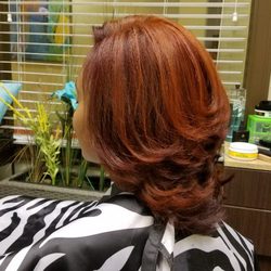 Natural Hair Salon & Spa - Natural hair highlighted with the silk blowout beautiful color for the Fall season!