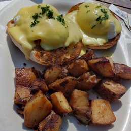 Eggs Benedict sans bacon with potatoes
