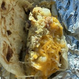 Potato, egg, bacon and cheese taco. Potato, egg, bacon and cheese taco.