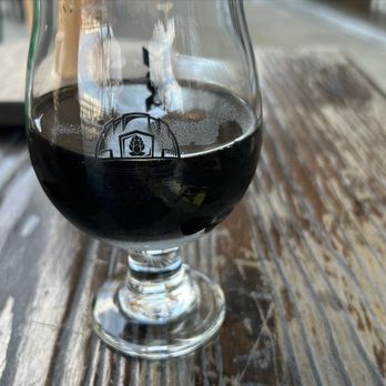 The Garage Brewery - a glass of beer on a table - Breweries Near Me - Chesapeake, Virginia The Garage Brewery - a glass of beer on a table - Breweries Near Me - Chesapeake, Virginia