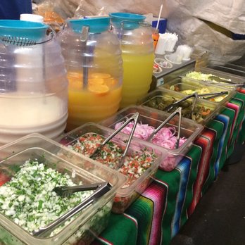 Tacos El Colima - a variety of tacoss on a table - Street Vendors Near Me - Los Angeles, California Tacos El Colima - a variety of tacoss on a table - Street Vendors Near Me - Los Angeles, California