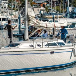Pacific Sail - Happy customers returning from a bareboat charter.
