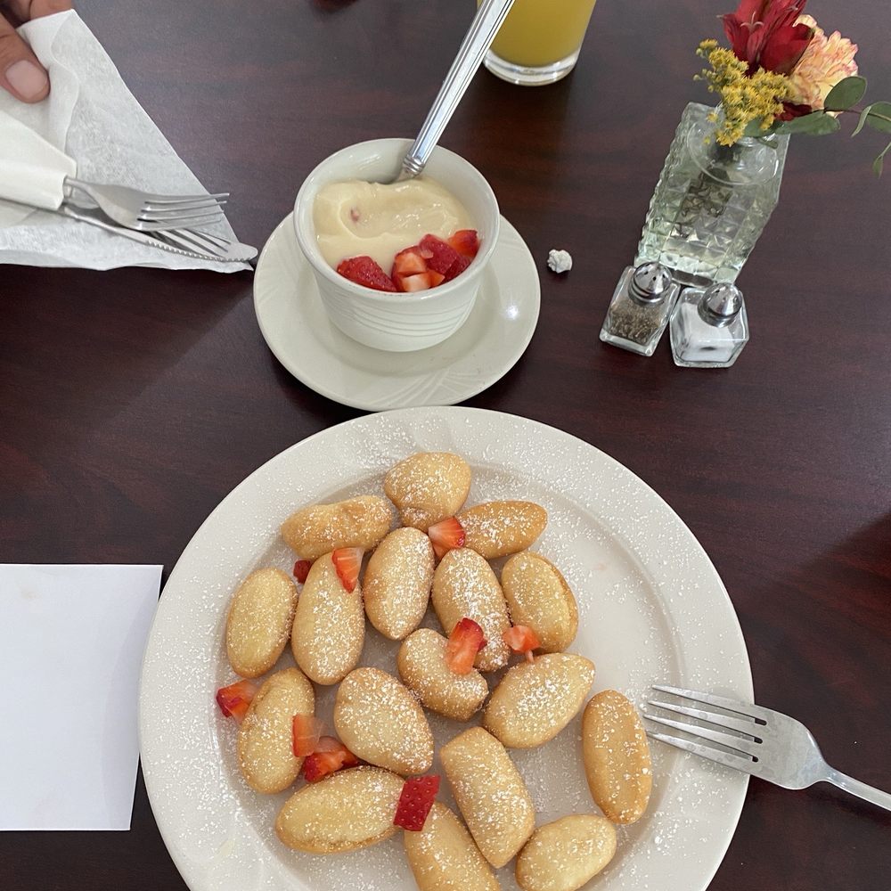 Lafourche Landing - Another picture of the beignets. The strawberries make it a perfect bite because it cuts through the sweetness. - Salad Near Me - Golden Meadow, Louisiana Lafourche Landing - Another picture of the beignets. The strawberries make it a perfect bite because it cuts through the sweetness. - Salad Near Me - Golden Meadow, Louisiana