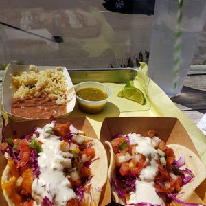 Photo of South Beach Bar & Grille - San Diego, CA, United States. A Mahi taco and a Calamari taco on - Taco Tuesday