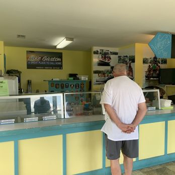 Wakeboard Willie's - a man and a woman standing in front of a counter - Ice Cream & Frozen Yogurt Near Me - Littleton, North Carolina Wakeboard Willie's - a man and a woman standing in front of a counter - Ice Cream & Frozen Yogurt Near Me - Littleton, North Carolina