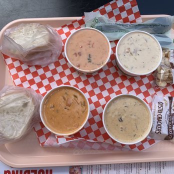 Pike Place Chowder - Top left: seafood bisque. Top right: New England clam chowder. Bottom left: smoked salmon chowder. Bottom right: crab & oyster chowder. - Seafood Near Me - Seattle, Washington