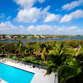 Mangrove Bay - A view of our pool and intracoastal waterway from a balcony in one of our Independent Living apartments - Assisted Living Facilities Near Me - Jupiter, Florida