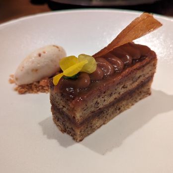 Indian Accent - black rice chikki
banana sticky cake, salted caramel toffee sauce - Indian Near Me - New York, New York Indian Accent - black rice chikki
banana sticky cake, salted caramel toffee sauce - Indian Near Me - New York, New York
