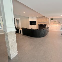 TMC Construction Services - TMC Construction Services remodeled this basement with custom built-ins, new flooring, stone columns, and more...