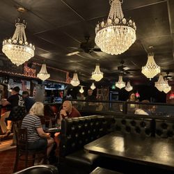 Dark, old fashioned, and kitschy vibes. Definitely transports you away from the bright world outside.