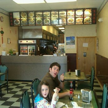 New China - a man and a little girl sitting at a table in a restaurant - Chinese Near Me - Newcastle, Oklahoma New China - a man and a little girl sitting at a table in a restaurant - Chinese Near Me - Newcastle, Oklahoma