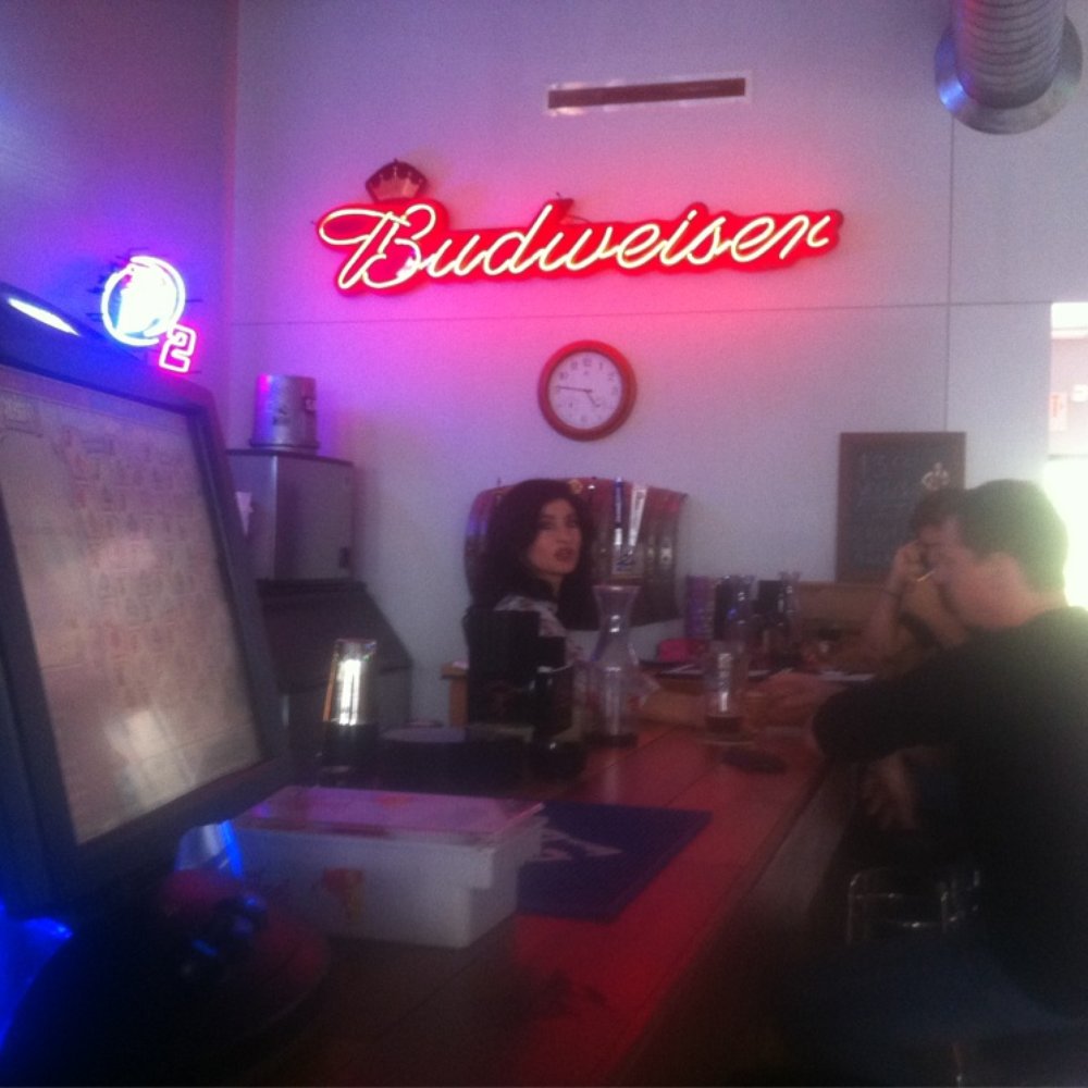 Cody Ray's Saloon - two people sitting at a bar - Sports Bars Near Me - Pflugerville, Texas Cody Ray's Saloon - two people sitting at a bar - Sports Bars Near Me - Pflugerville, Texas
