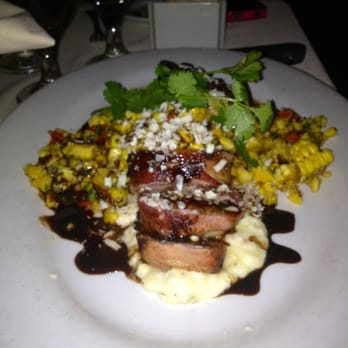 Roaring Fork - Bacon wrapped pork tenderloin with Mexican street corn - American Near Me - Austin, Texas