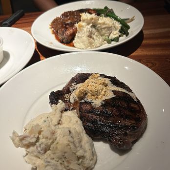 Redrock Canyon Grill - Ribeye steak, mashed potatoes, porkchop behind it, green beans - American Near Me - Oklahoma City, Oklahoma