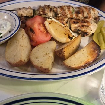 Milos Meze - Chicken Souvlaki  Spiced lamb skewer grilled with cucumber, tomato salad, tzatziki, and potatoes - Greek Near Me - San Francisco, California