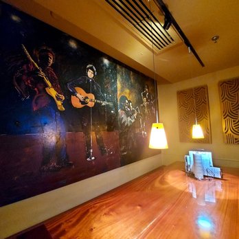 Amherst Brewing Company - a man playing a guitar - Breweries Near Me - Amherst, Massachusetts