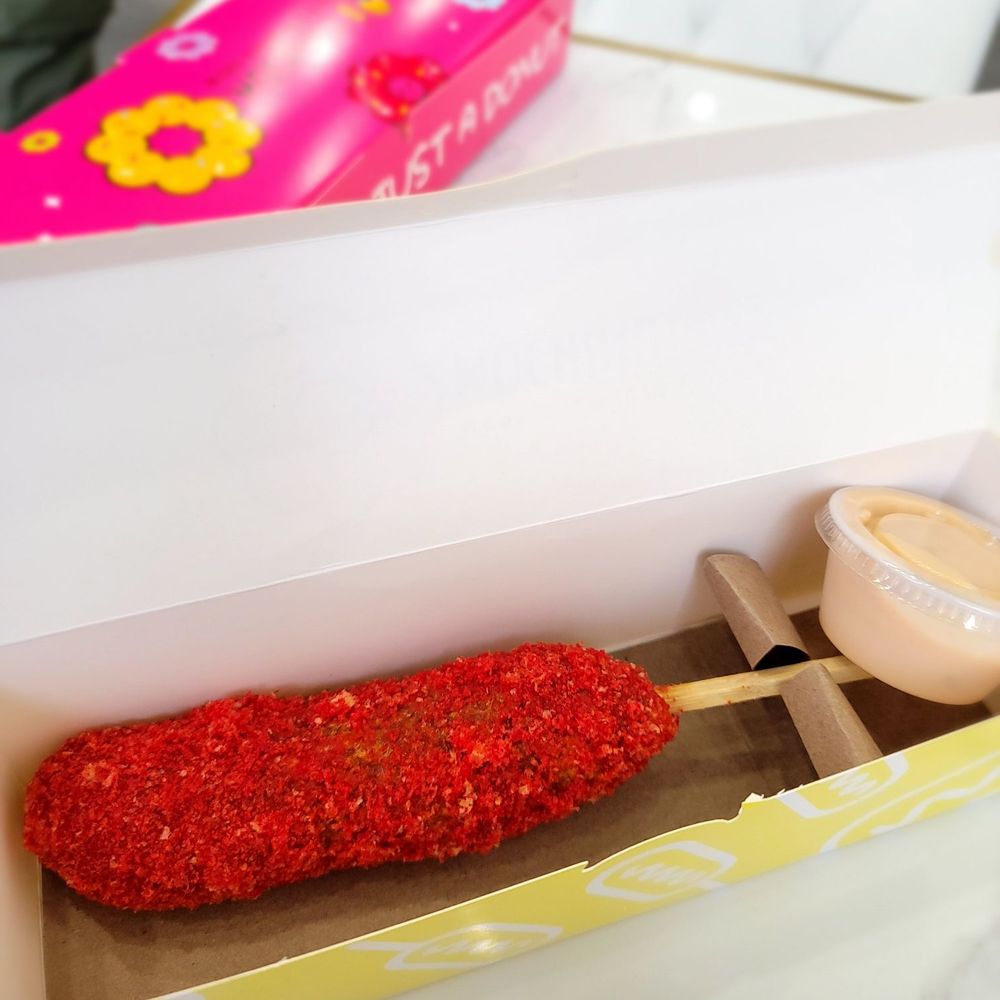 Mochinut - Hot cheetos corn dog with house sauce - Donuts Near Me - Cary, North Carolina