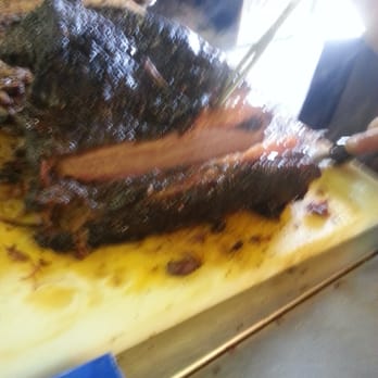 City Meat Market - Brisket being cut. - Meat Shops Near Me - Giddings, Texas