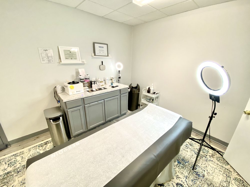 Enlighten Skin and Wellness Logo