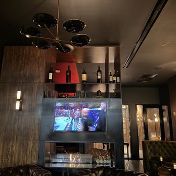 El Vecino - UFC on the tv screen - Cigar Bars Near Me - Miami, Florida