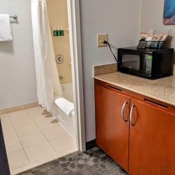 Courtyard by Marriott Syracuse Carrier Circle - Across from the bathroom sink area is a microwave coffee maker and a refrigerator underneath - Hotels Near Me - East Syracuse, New York Courtyard by Marriott Syracuse Carrier Circle - Across from the bathroom sink area is a microwave coffee maker and a refrigerator underneath - Hotels Near Me - East Syracuse, New York