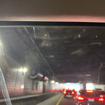 Mobile Tint Shop - Scratches in the windshield after a tint. You can see the bottom border of where the tint was, and multiple scratches above it. - Auto Glass Services Near Me - East Boston, Massachusetts Mobile Tint Shop - Scratches in the windshield after a tint. You can see the bottom border of where the tint was, and multiple scratches above it. - Auto Glass Services Near Me - East Boston, Massachusetts